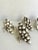This is a set of 6 beautifully, hand-made pottery napkin rings in the shape of a draped cluster of grapes, grape leaves...