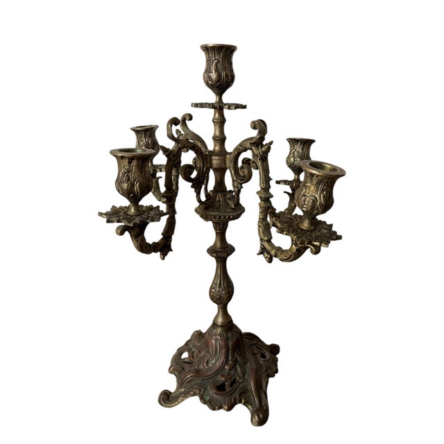 The Rococo style, defined by the use of curving natural forms (e.g. c-scrolls, undulating curves, stylized foliage)...