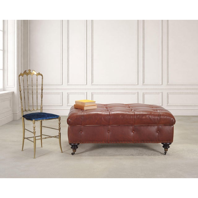 A beautifully crafted rectangular country English tufted leather "Brierly" writer's chair storage ottoman on casters...