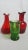 Two red Blenko and one green Pilgrim Pitcher. All three are in perfect condition.