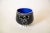 This interesting studio ceramic small bowl is signed Goldenberg. It has a great stick womens figure as the center. It is...