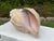 Large vintage decorative conch shell sculpture with a beautifully aged, hand-painted finish in soft ivory, blush, pale...