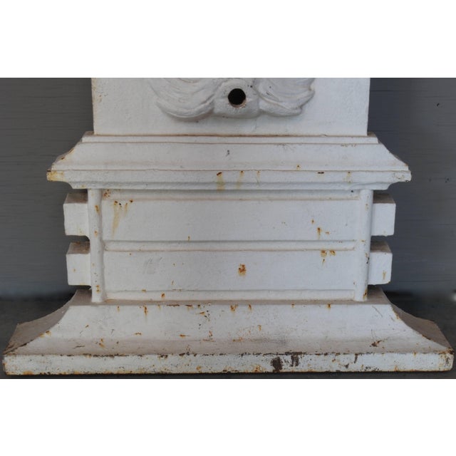 This beautiful piece is from the late 19th century. Adorned with a lady wrapped in fabric and ram heads on either side at...