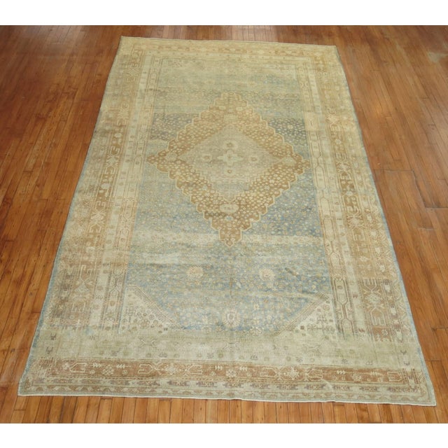 Stunning geometric antique Khotan rug in soft blue and caramel from the 1st quarter of the 20th century Measures: 7' x...