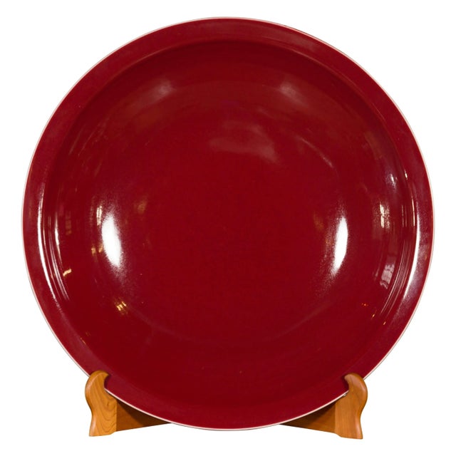 A large Chinese vintage porcelain platter from the mid-20th century, with oxblood color. Created in China during the mid-...