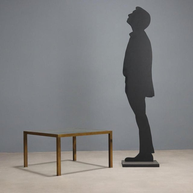 Vintage coffee table with a brass frame and a square glass top. In good overall condition with some signs of wear, as...