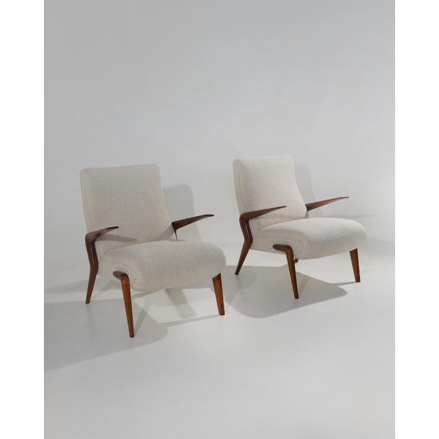 A pair of p71 armchairs designed by osvaldo borsani for tecno in the 1950s, a project in which the upholstered volume and...