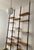 Bookcase in light teak, iron rods and brass finishes, completely restored, the height is adjustable. It has 14 shelves.