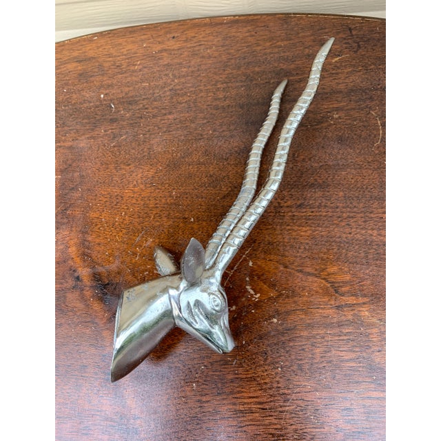 A beautiful contemporary cast aluminum wall-mounted sculpture of an antelope head USA, Late 20th Century Measures: 4.25"W...