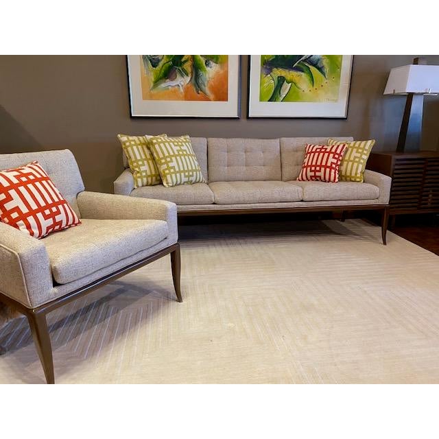 Custom sofa in the styling of Robsjohn-Gibbings Widdicomb, custom tufting in the style of Florence Knoll in classic Kravet...