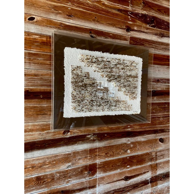 Paper Installation. Beautiful raw edge textured paper is bent in a geometric pattern to create a soft and clean image. Set...