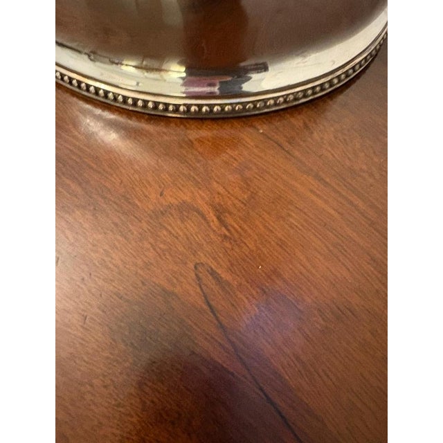 Antique Victorian quality silver plated meat cover having an ornate shaped handle above a silver plated meat dome with a...