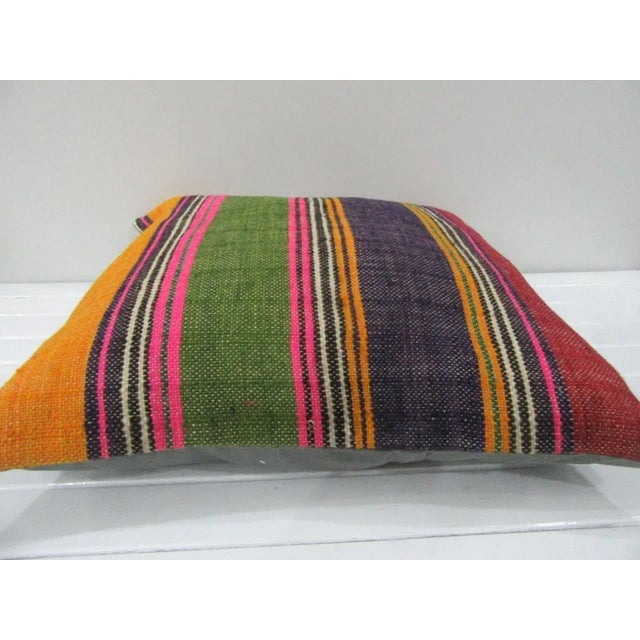 This is a pillow cover made from a vintage kilim rug. The piece was properly washed and ready to use. Pillow inserts not...