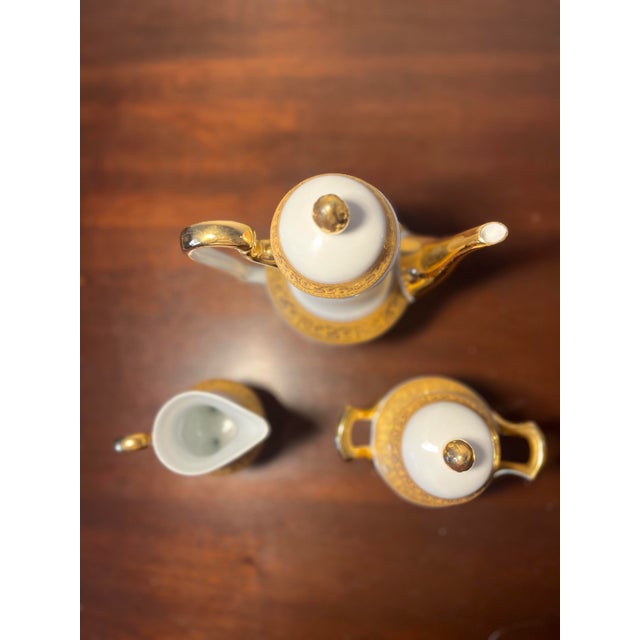 Vintage white porcelain demitasse coffee or tea set . Includes coffee/ tea pot , cream er, sugar pot, 6 demitasse cups ,...