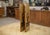 An elegant antique four-panel screen, made of gilded wood, each panel adorned with an oil painting depicting generous...