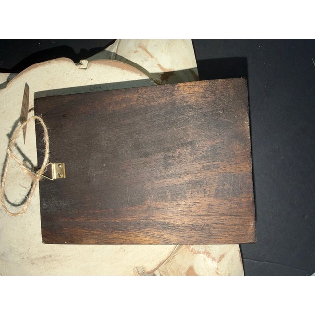 Vintage MCM wall plaque with ceramic cross and melted glass.