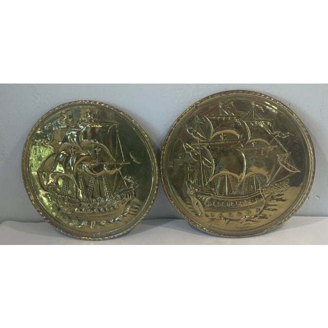 Lovely embossed brass wall plates featuring ships.