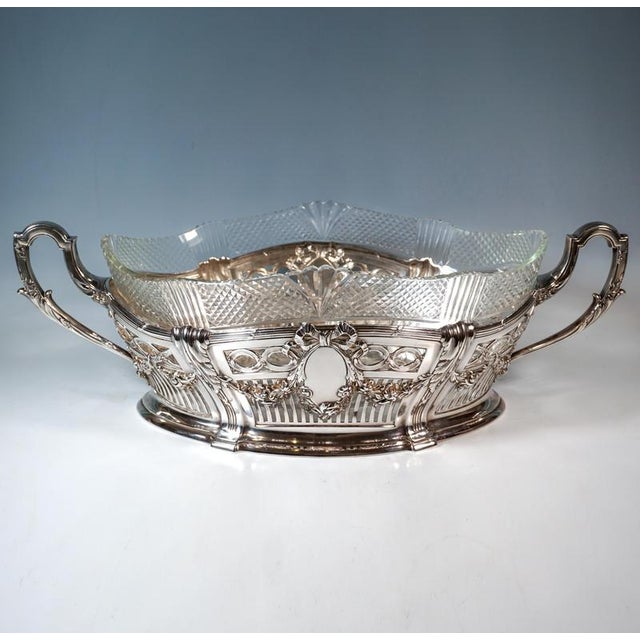 Representative elegant silver jardinière in an elliptical basic shape, standing flush on a stepped lower edge, outwardly...