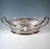Representative elegant silver jardinière in an elliptical basic shape, standing flush on a stepped lower edge, outwardly...
