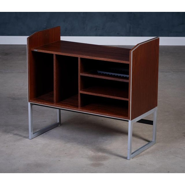Iconic Danish media console from Bang & Olufsen, crafted in rich rosewood with aluminum edges and frame. Featuring elegant...