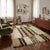 Modern wool rug, large knot and machine made. This piece is attributed to the mentioned designer/maker. It has no...