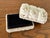 Pure white Coastal trinket box covered in rosettes formed by scallop shells. Inner lining is black velvet. Please see...