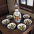 The Seven Piece Whole Home Painted Talavera Style Olive Oil Dipping Set is a beautifully crafted set featuring a floral...