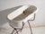 This antique bathtub in enamelled iron rests on a folding stand of bent iron tube. Originates from Central Europe, from...
