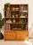 A substantial Danish modern multimedia shelf crafted in warm teak with an architectural arrangement of open storage...