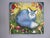 This oil on canvas painting features a serene blue fox nestled among vibrant foliage and whimsical mushrooms, creating a...