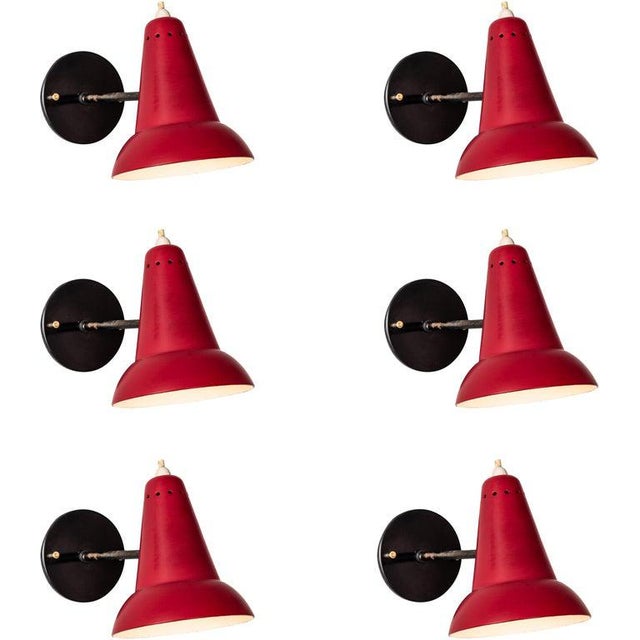 1950s Italian red articulating sconces attributed to Gino Sarfatti. Executed in brass and red painted aluminum. Sconces...