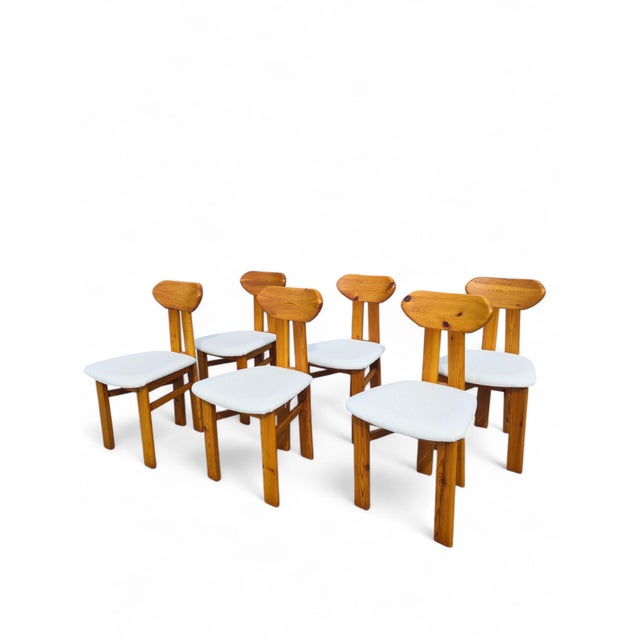 A set of four Scandinavian pine dining chairs dating from the 1970s, combining simple construction with the warm organic...