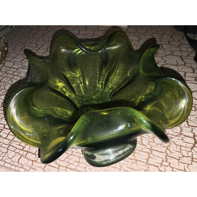 This vintage Murano style glass bowl, created by Barovier Toso, features a beautiful flower console design with rolled...