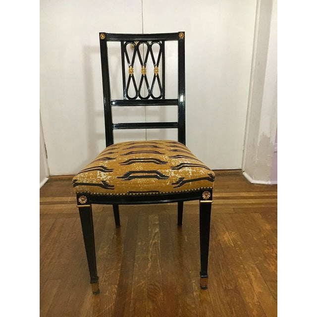 A Set Of 4 Italian Export Parcel Gilt Neoclassical Style Side Chairs By Rubelli. Each chair is covered in Black lacquer,...