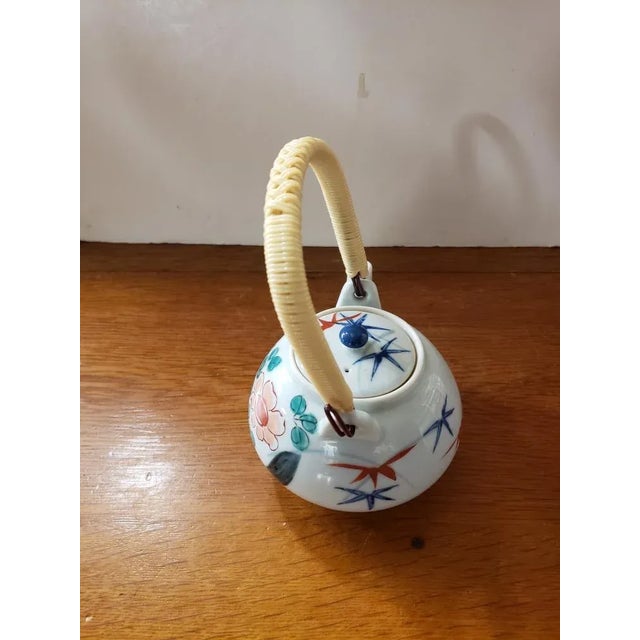Japanese Circa 1920 Japanese Kakiemon Porcelain Floral/Bird Motif Tea Pot With Wire Wrapped Rattan Handle For Sale - Image 3 of 7