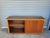 Great looking vintage mid-century credenza. Two large walnut doors that slide to reveal two compartment with two...