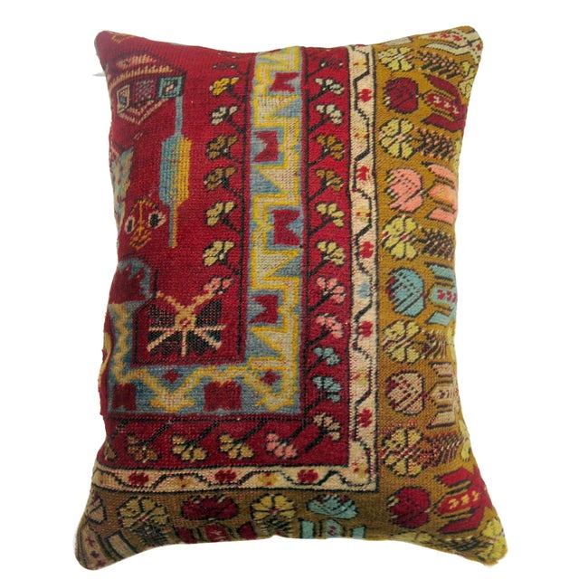 Pillow made from an antique Turkish prayer rug. Measures: 17" x 23".