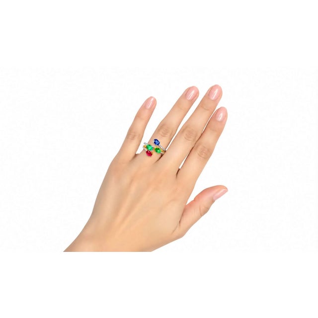 This 18K Gold Duo Bypass Ring Set features numerous brilliant round diamonds totaling 0.30 carats, along with one oval...