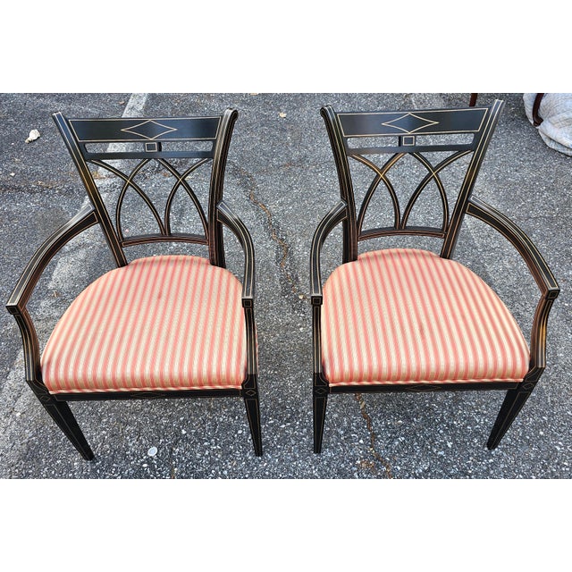 A Pair of John Widdicomb Neoclassical Style Partial Gilt Ebonized Wood Rose and Champagne Striped Upholstered Armchairs....