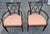 A Pair of John Widdicomb Neoclassical Style Partial Gilt Ebonized Wood Rose and Champagne Striped Upholstered Armchairs....