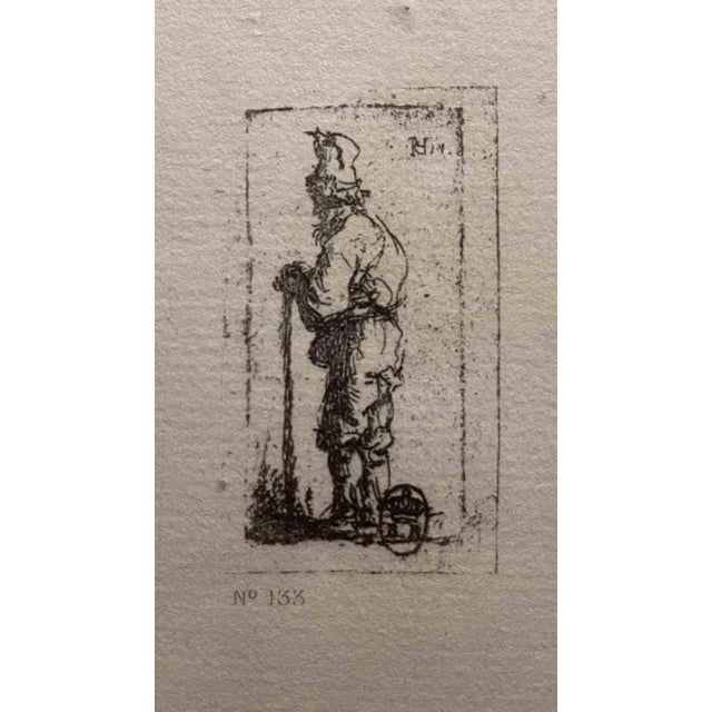 Beggar Leaning on a Stick, Facing Left is an etching on ivory-colored paper realized after an etching by Rembrandt. This...