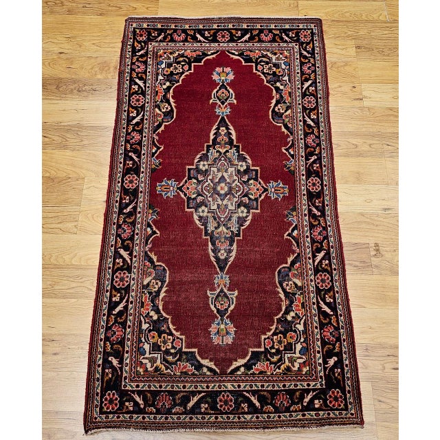 "A timeless vintage Persian Kashan area rug from the third quarter of the 20th century featuring a refined floral...