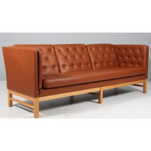 Erik Jørgensen three-seat new upholstered with cognac pure full grain anilin leather. Frame of beech. Model EJ 315/3, made...