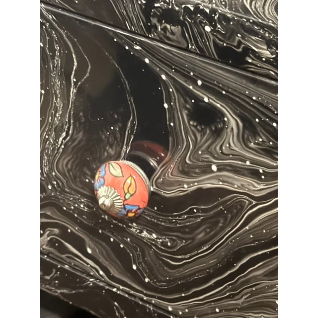 MadeGoods dresser with a hand-applied marbled lacquer finish in black and silver (suminagashi-style swirl pattern)....