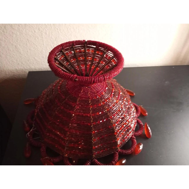 This is a Hand made Microbeads Red 9" Wide Decorative Basket. Great color & craftsmanship. Great decor piece. Procured...