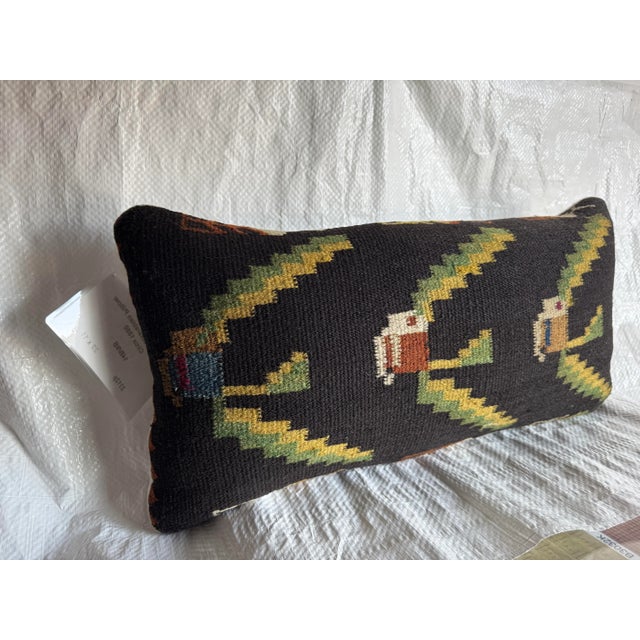 A rare 19th-century Bessarabian pillow handwoven circa 1880, featuring a striking geometric and floral motif in earthy...