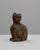 This 20th-century French wooden cat sculpture captures a sense of quiet grace and character through its primitive, hand-...