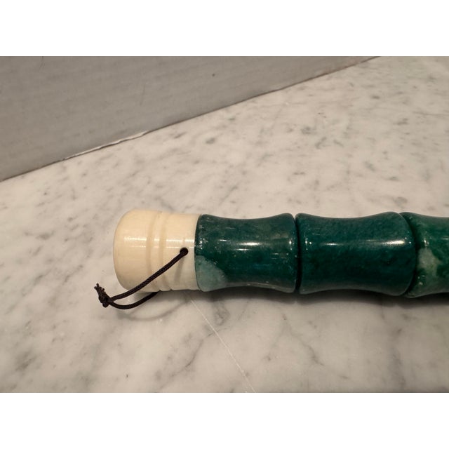 A vintage Chinese calligraphy brush in brilliant green stone and light horse hair. A decorative piece on any coffee table.