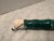 A vintage Chinese calligraphy brush in brilliant green stone and light horse hair. A decorative piece on any coffee table.