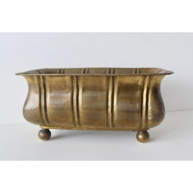 Vintage elongated brass ribbed planter manufactured in Italy. Featuring a rectangular, trough-like design made from...